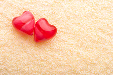 Fototapeta premium two red hearts on terry towel