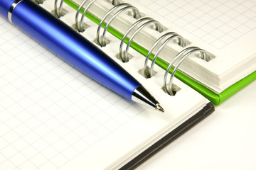Notebook and a pen closeup