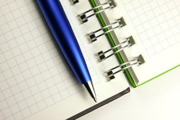 Notebook and a pen closeup