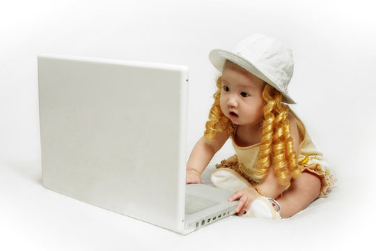 baby girl with laptop