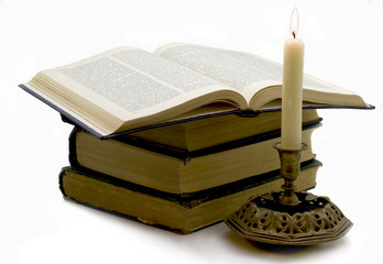 Opened book and candle