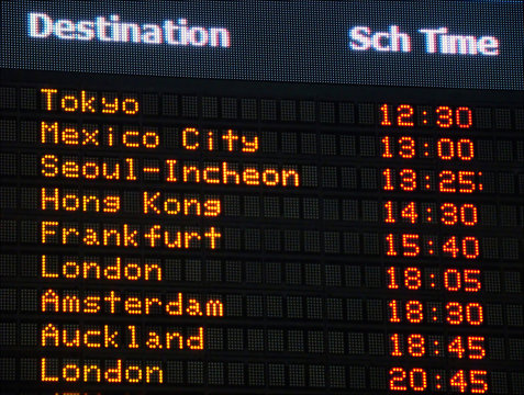 Canadian airport information board, international departures.