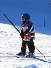 young boy skiing in tirol, austria