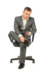 businessman with phone on chair