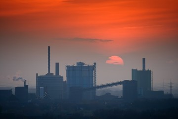 Industrial skyline at sunset