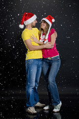Obraz premium Young Couple Playing WIth Snowflakes