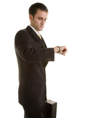 Young Man in Suit with Briefcase Looking at Watch