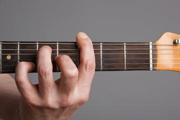 Barre chord on electric guitar