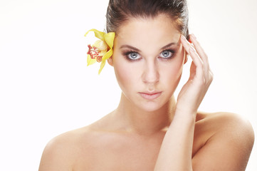 Fototapeta premium happy young woman with yellow flower