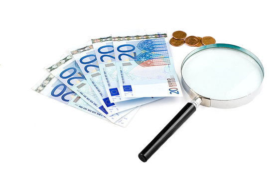 Isolated euro money under the reading glass