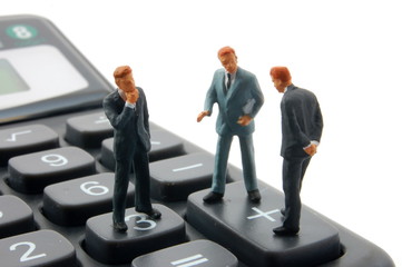 toy business man on calculator isolated