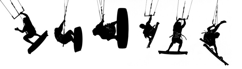silhouettes of kitesurfer over white