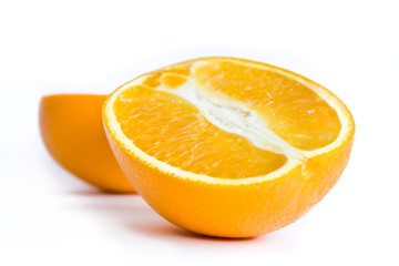 Photo of isolated on white two halfs of orange