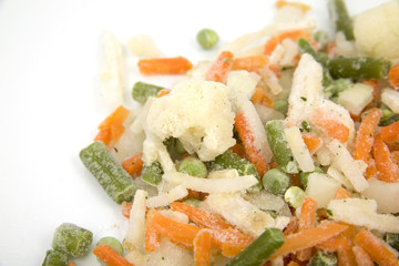 Frozen mixed vegetables in isolated white background