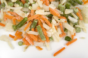 Frozen mixed vegetables in isolated white background