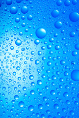 water drops over blue background