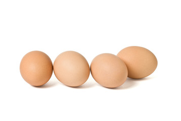 Four brown eggs