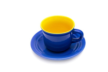 Blue and yellow coffee cup and saucer.