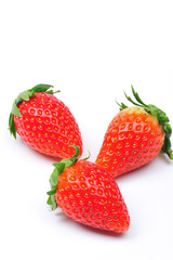 three strawberries isolated in white background