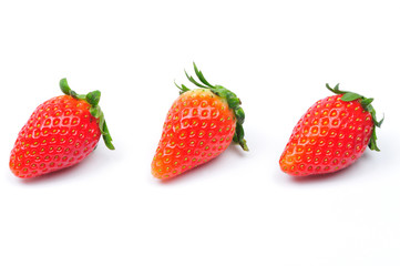 three strawberries isolated in white backgound