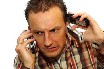 Busy businessman with 3 cell phones getting answers