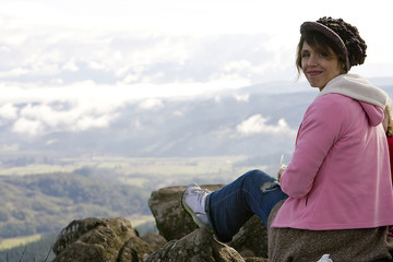 Fototapeta na wymiar Woman on top of a mountain