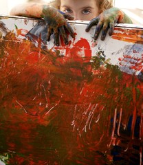 Children artist hands painting multi colors