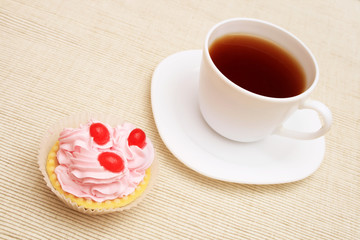 Cup of coffee and cupcake.