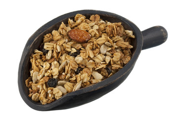 scoop of granola with nuts, seeds and raisins