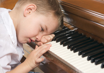Frustrated Child on the Piano