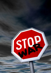 "STOP" sign with graffiti against the night sky