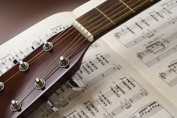 Guitar close up on sheet music
