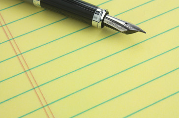 Fountain pen on legal pad