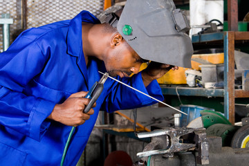 african welder in working