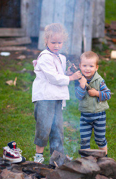 children near campfire