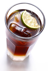 glass of drink with ice and lemon