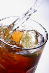 glass of  drink with ice and lemon close up