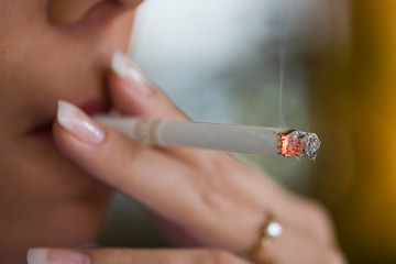 Smoking woman with a cigarette © Gina Sanders