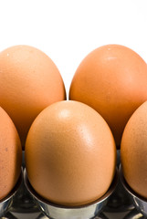 brown eggs on eggcups