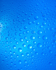 water drops over blue background