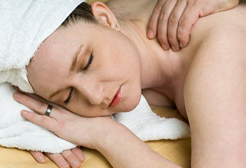 Fototapeta na wymiar Beautiful Salon Woman Getting Massage Therapy at Spa