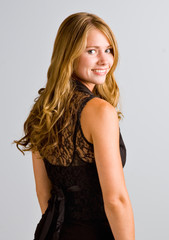 Fototapeta premium Young woman with long hair smiling