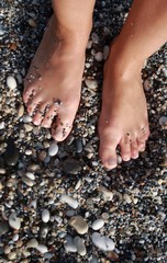 Feet on Pebble Beach