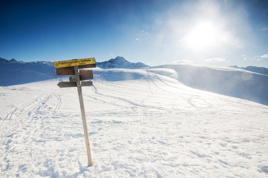 The signpost in the winter mountains