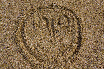 Fototapeta na wymiar happy face on a beach