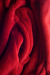 close up of folds in red velvet fabric