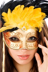 Beautiful woman in carnival mask over white background
