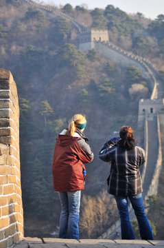 visitors standing on the great wall of china