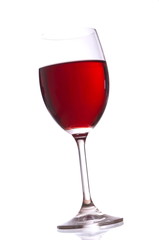 Glass with red wine on white background