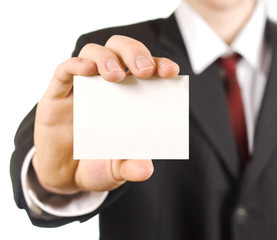 man in business suit showing blank card